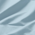 Close-up of smooth Baby blue Egyptian cotton fabric with a lustrous sateen weave and soft drape.