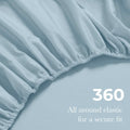 Close-up of an Baby blue fitted sheet with 360-degree elastic for a secure fit around the mattress.