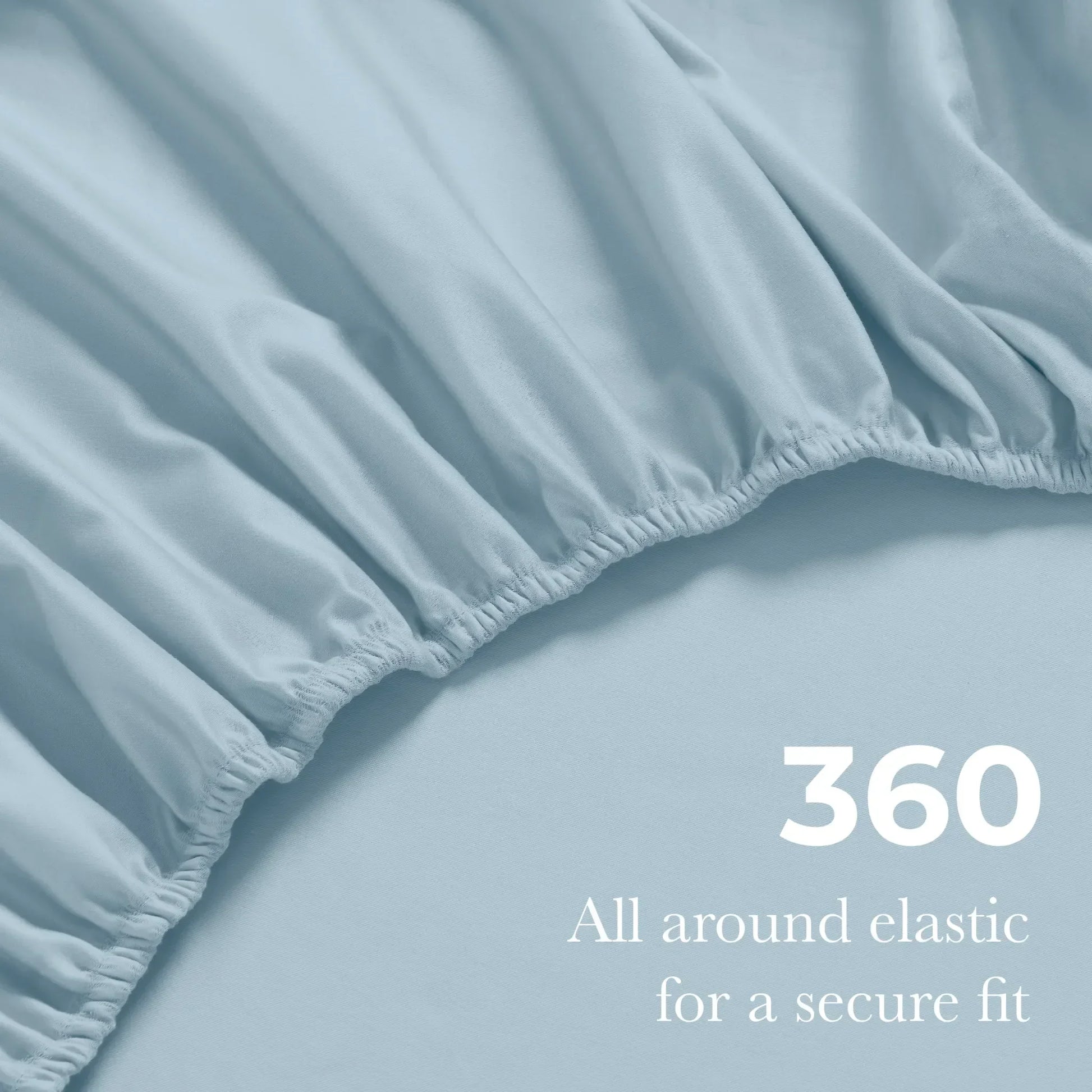 Close-up of an Baby blue fitted sheet with 360-degree elastic for a secure fit around the mattress.