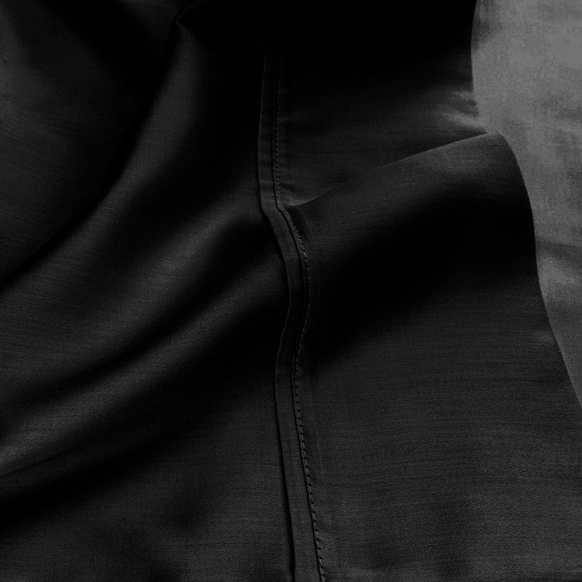 Black 530 Thread Count Egyptian Cotton Sateen sheet hem and stitching detail close-up