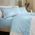 Blue 600 Thread Count Cotton Blend Bed Sheet Set with Imperia embroidered hem details on a luxury lifestyle bed display.