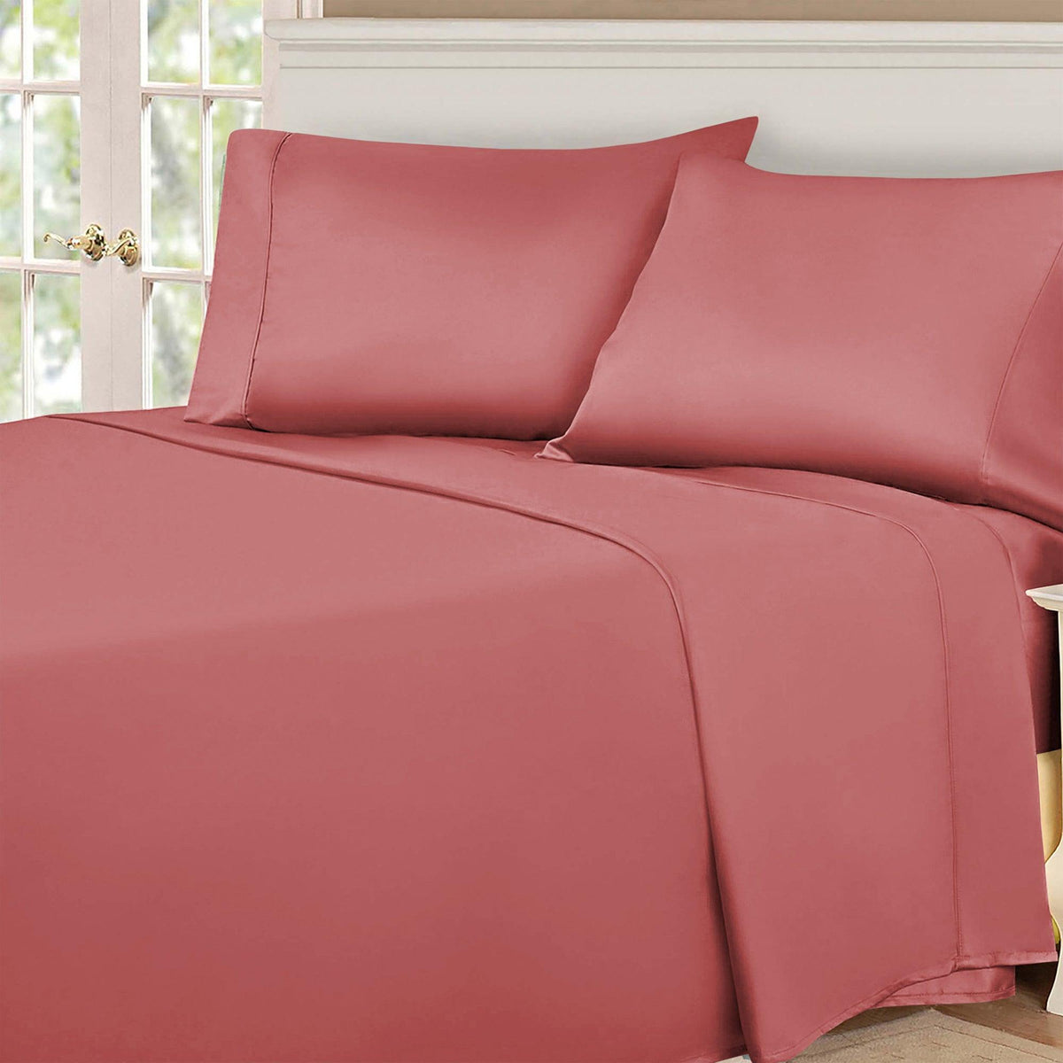 Blush Pink 530 Thread Count Egyptian Cotton Sateen Bed Sheet Set displayed on a modern bed