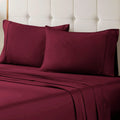 Burgundy 700 Thread Count Egyptian Cotton Sateen Bed Sheet Set displayed on a modern bed