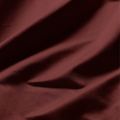 Close-up of smooth Burgundy Egyptian cotton fabric with a lustrous sateen weave and soft drape.
