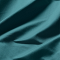 Close-up of smooth Caribbean blue Egyptian cotton fabric with a lustrous sateen weave and soft drape.