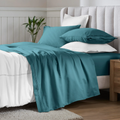 Caribbean blue Egyptian Cotton Sateen Sheet Set neatly arranged on a bed
