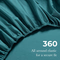 Close-up of an Caribbean blue fitted sheet with 360-degree elastic for a secure fit around the mattress.