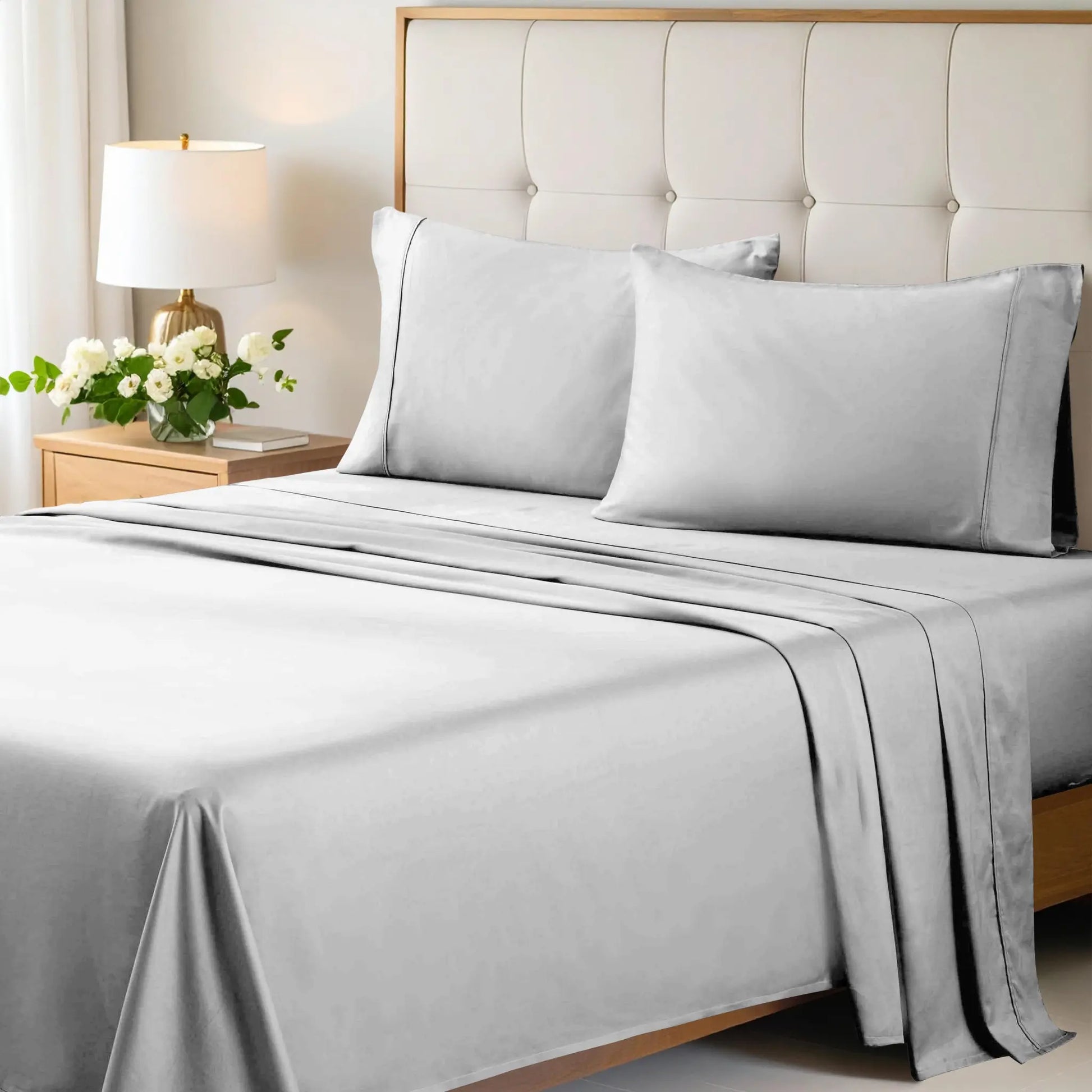 Chrome 700 Thread Count Egyptian Cotton Sateen Bed Sheet Set displayed on a modern bed