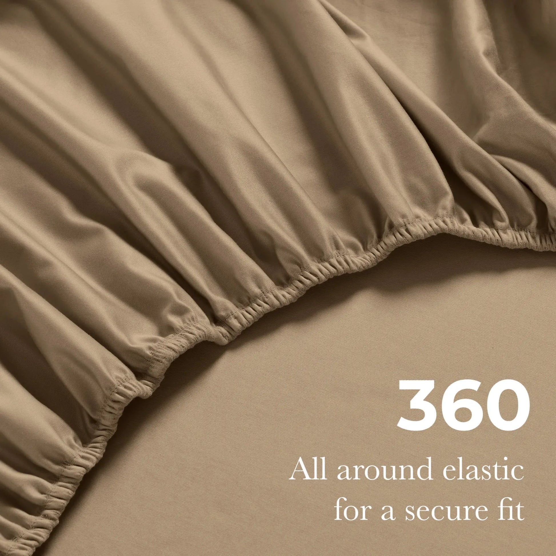 Close-up of a taupe fitted sheet with elastic gathering, featuring the text "360 All around elastic for a secure fit