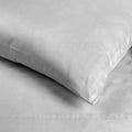 Close-up of chrome gray 700 thread count Egyptian cotton sateen sheets featuring a smooth fabric texture