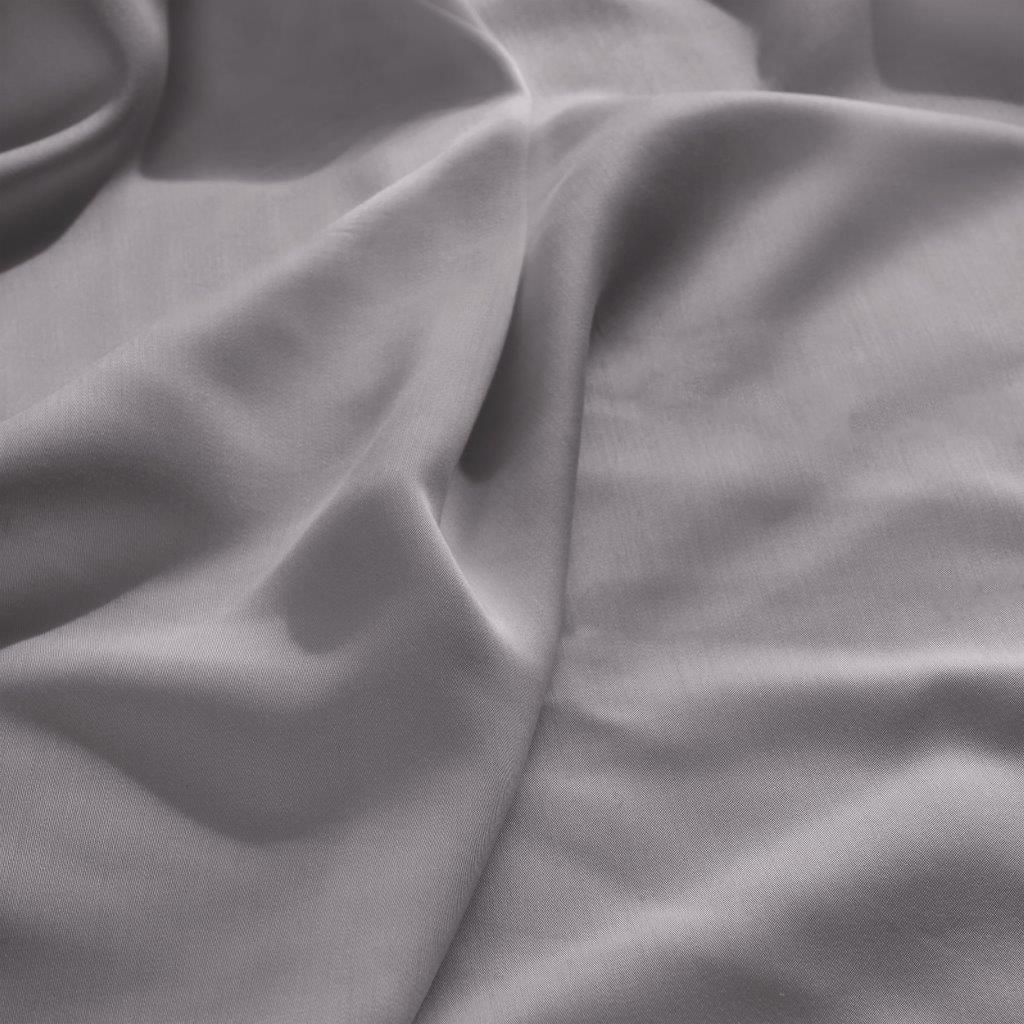 Close-up texture view of smooth, draped grey 300 thread count modal sheets made from beechwood