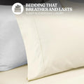 Close-up view of a cream colored cotton blend pillowcase showing stitched hem detailing and fabric texture.
