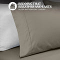 Close-up view of a dark grey cotton blend pillowcase showing stitched hem detailing and fabric texture