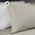 Close-up view of a stone gray cotton blend pillowcase showing stitched hem detailing and fabric texture
