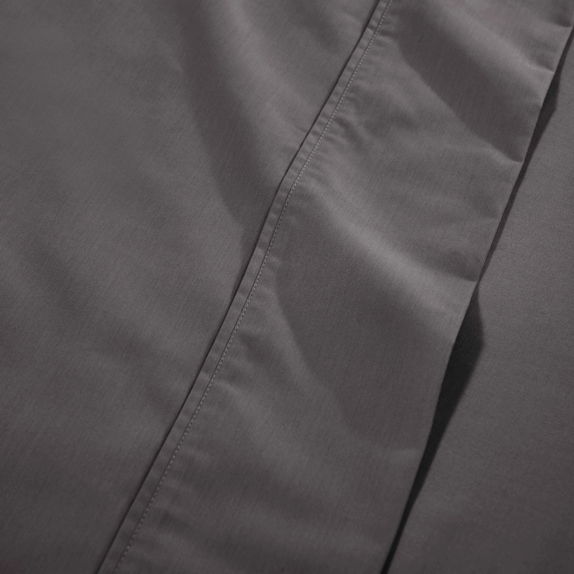 Dark gray 1000 Thread Count Cotton Blend Sheets Set solid deep pocket, hemline, and stitching close-up fabric texture