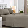 Dark grey 600 thread count cotton blend bed sheet set neatly spread across a mattress