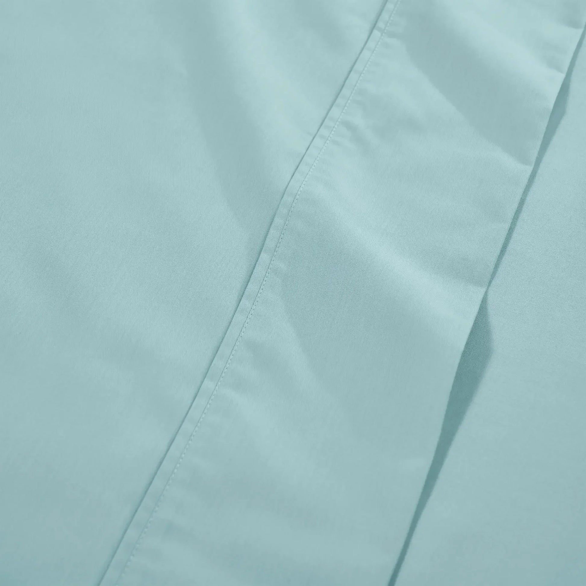 Detailed fabric close-up of light blue 600 thread count cotton blend solid deep pocket bed sheet