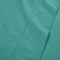 Detailed fabric close-up of teal 600 thread count cotton blend solid deep pocket bed sheet