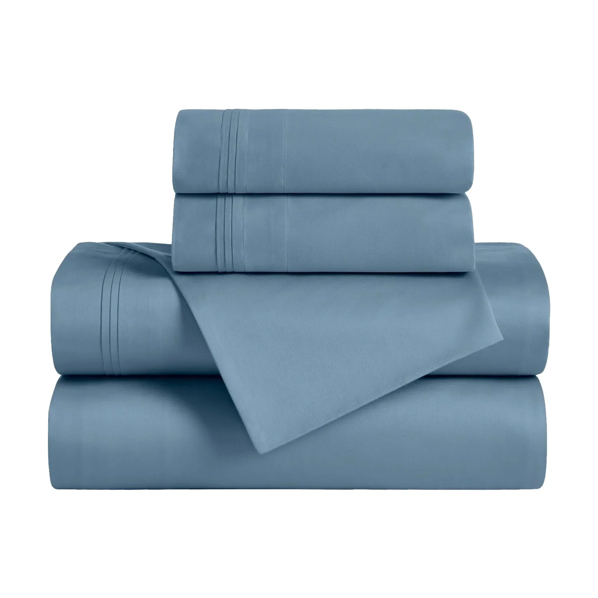 Folded Medium blue 650 thread count Egyptian cotton sateen sheet set with sheets and matching pillowcases.
