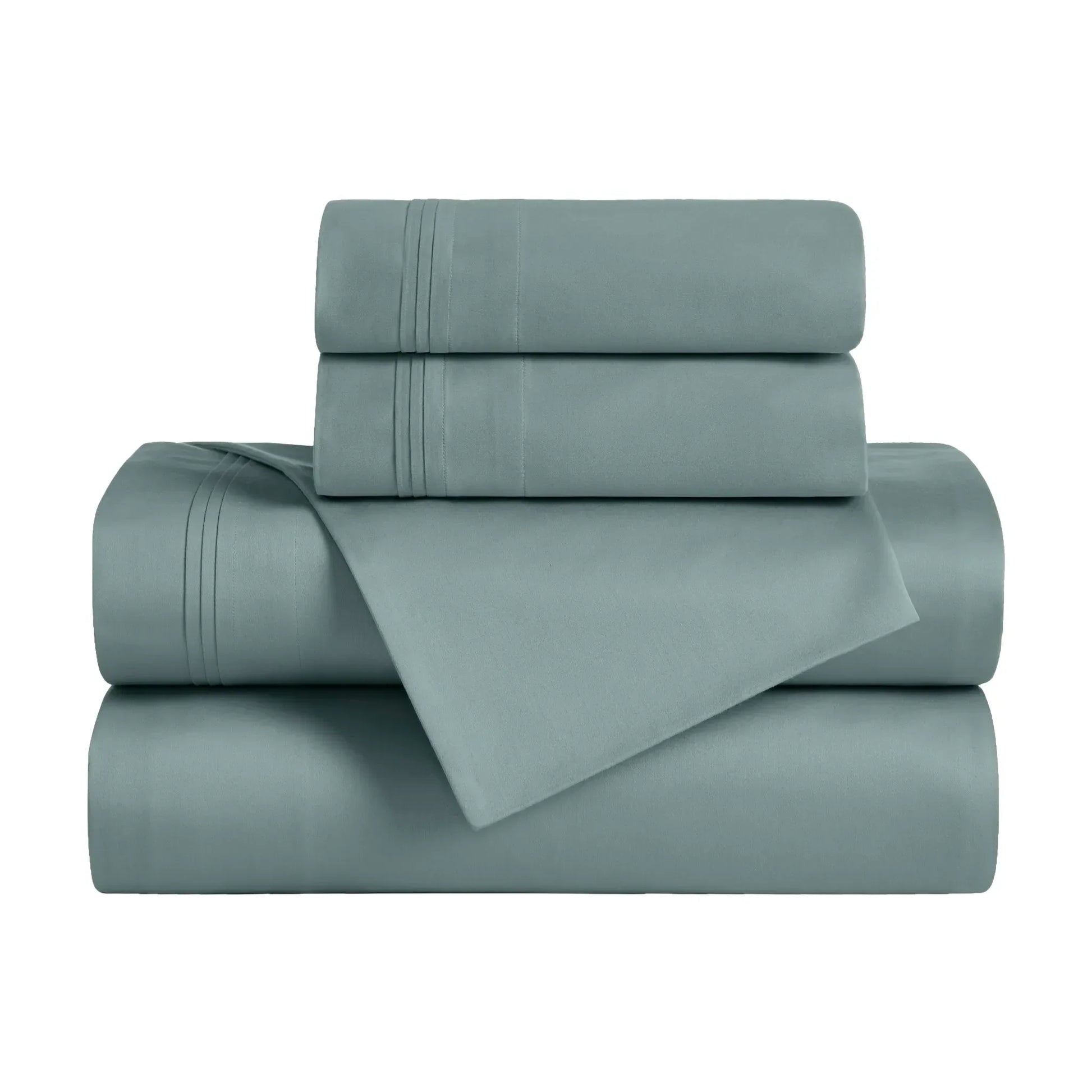 Folded Teal blue 650 thread count Egyptian cotton sateen sheet set with sheets and matching pillowcases.
