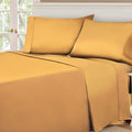 Gold Yellow 530 Thread Count Egyptian Cotton Sateen Bed Sheet Set displayed on a modern bed