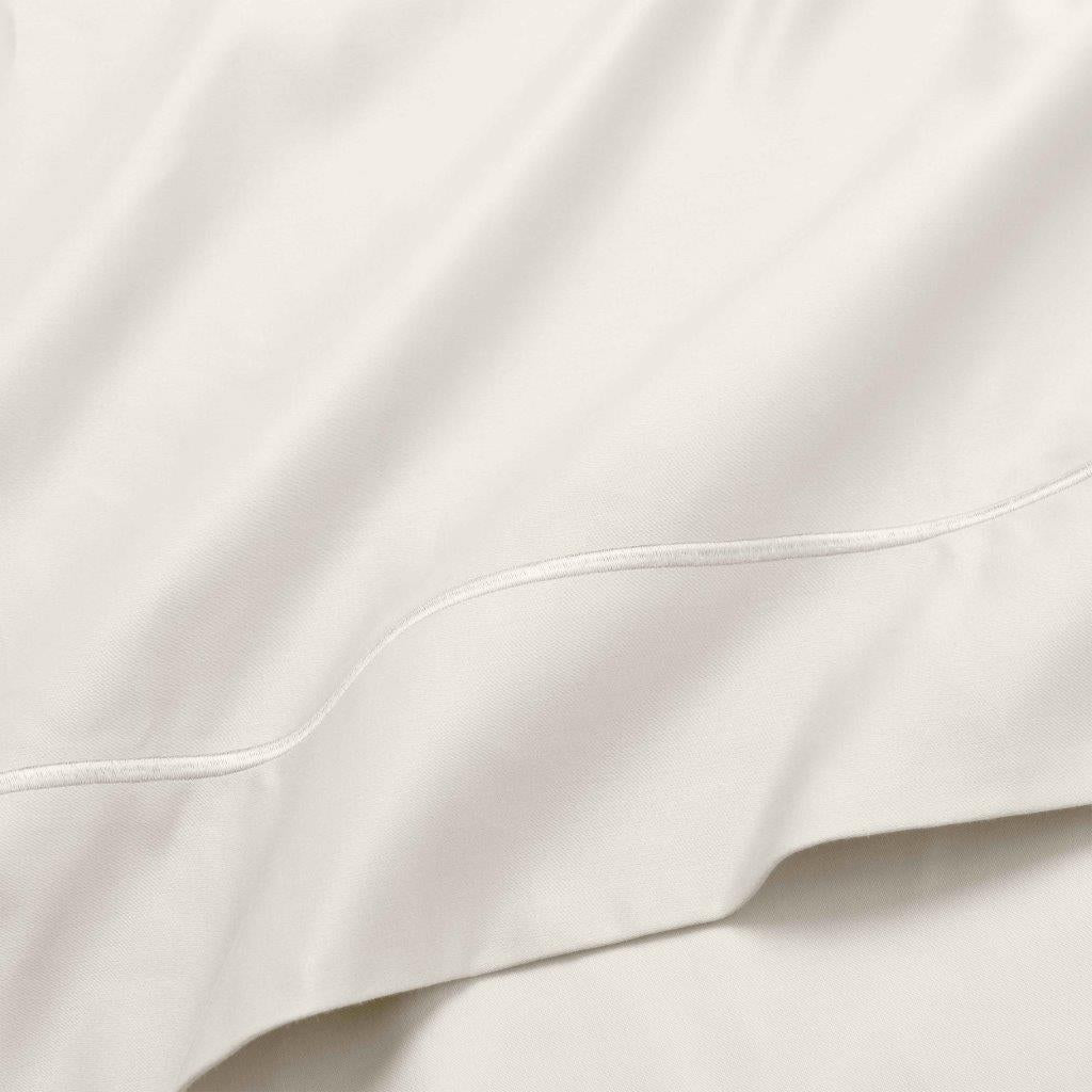 Ivory 1500 Thread Count Egyptian Cotton Sheets hotel quality embroidered hemline stitch close-up.