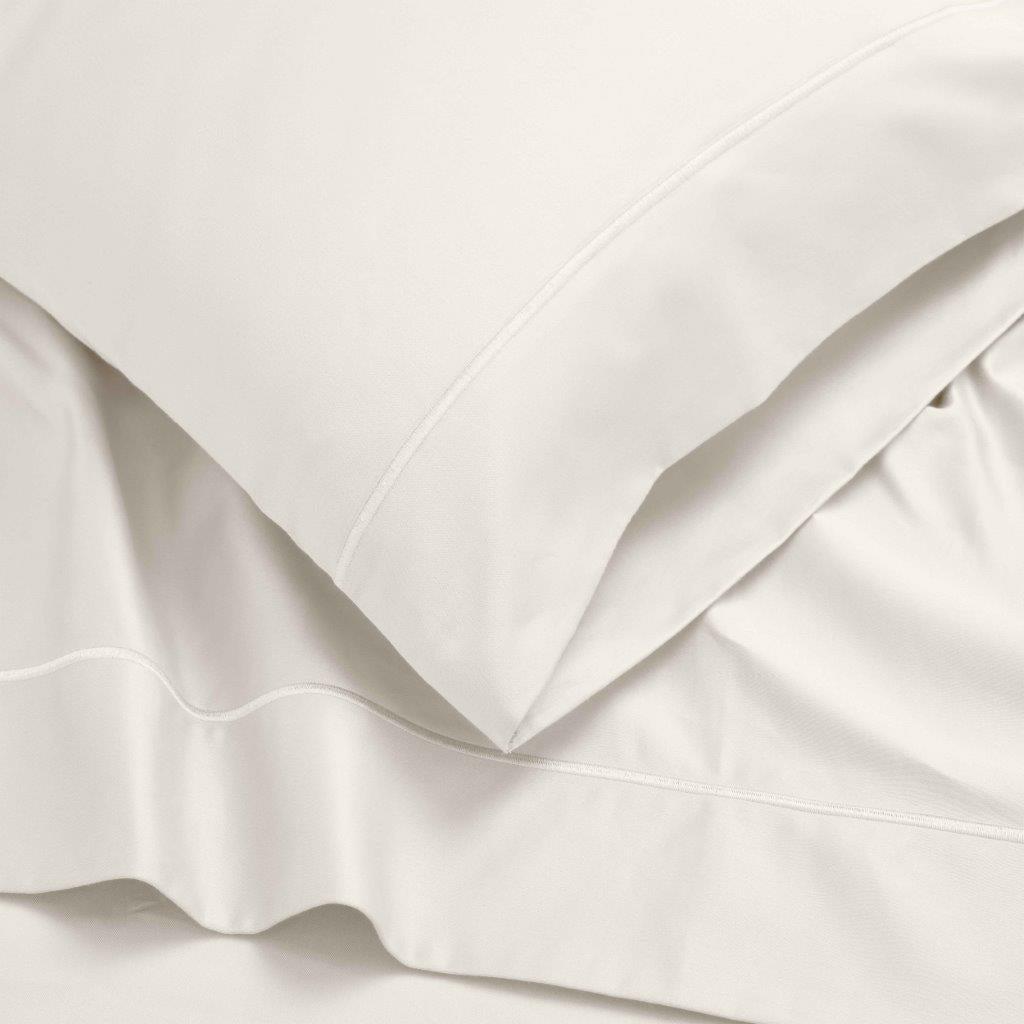Ivory 1500 Thread Count Egyptian Cotton bedding set pillowcase border and fabric drape detail.