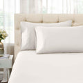 Ivory 1500 Thread Count Egyptian Cotton pillowcases and matching sheet set detail close-up.