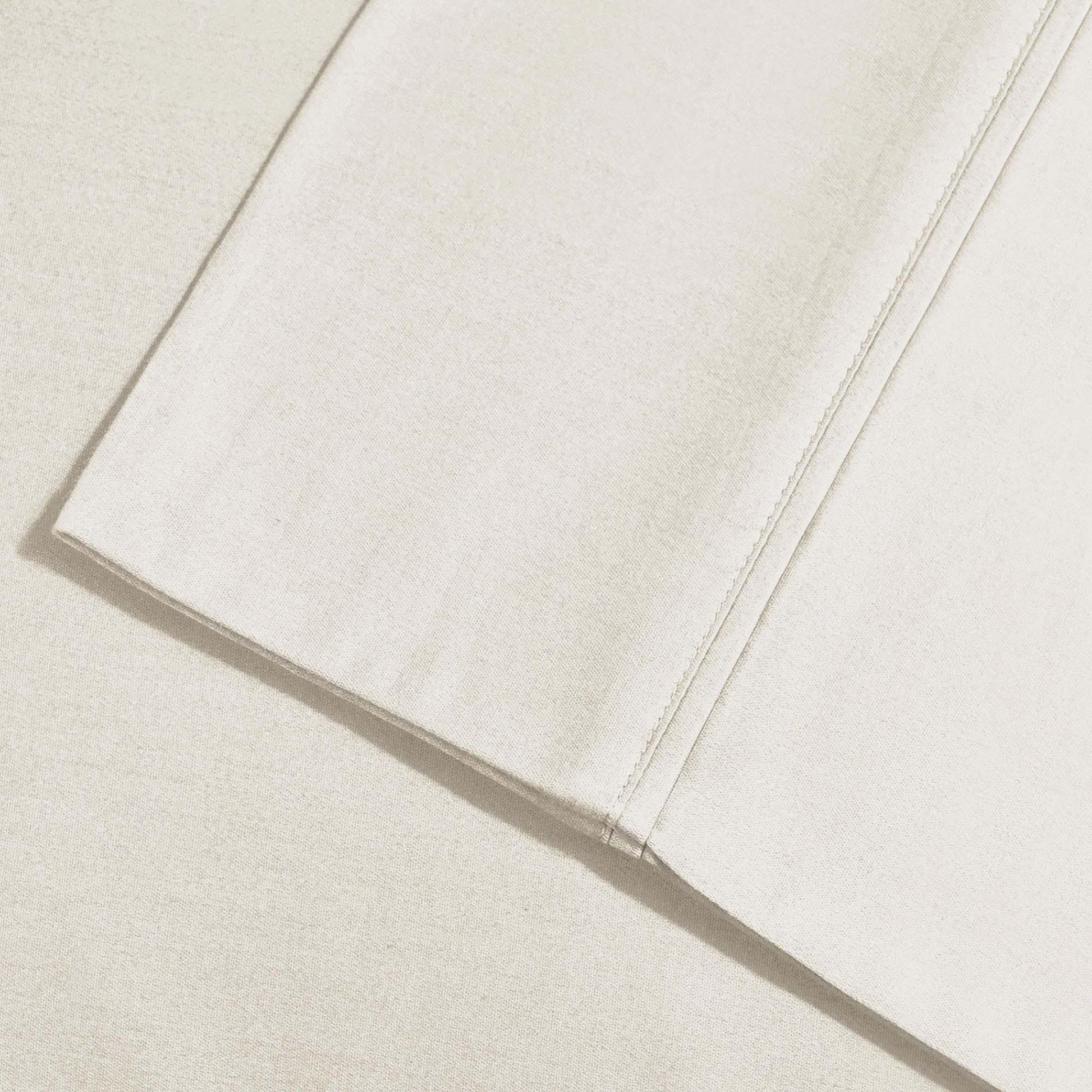 Ivory 800 Thread Count Cotton Blend Bed Sheet Set embroidered hemline stitch detail.