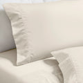 Ivory Imperia embroidered hem pillowcase set close-up detail.