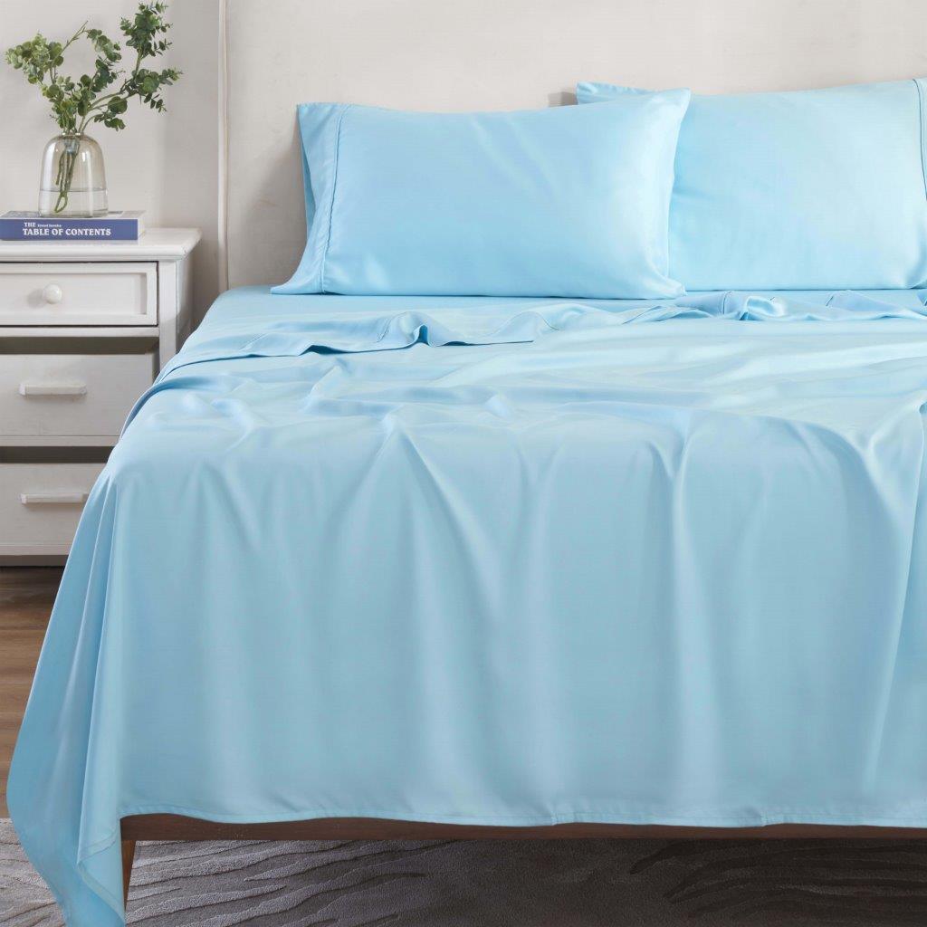 Light blue 300 Thread Count Modal Sheets Set made from beechwood displayed on a staged bed