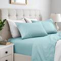 Light blue 600 thread count cotton blend bed sheet set on a neatly made bed