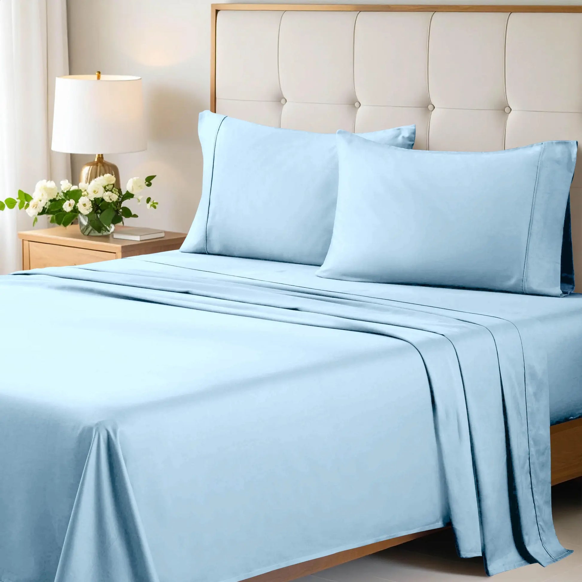 Light blue 700 Thread Count Egyptian Cotton Sateen Bed Sheet Set displayed on a modern bed