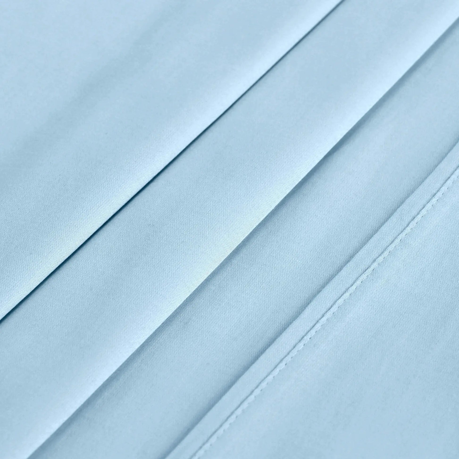 Light blue 700 Thread Count Egyptian Cotton Sateen sheet hem and stitching detail close-up