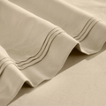 Close-up of Linen Egyptian cotton sateen sheet hems with decorative triple-row stitching.