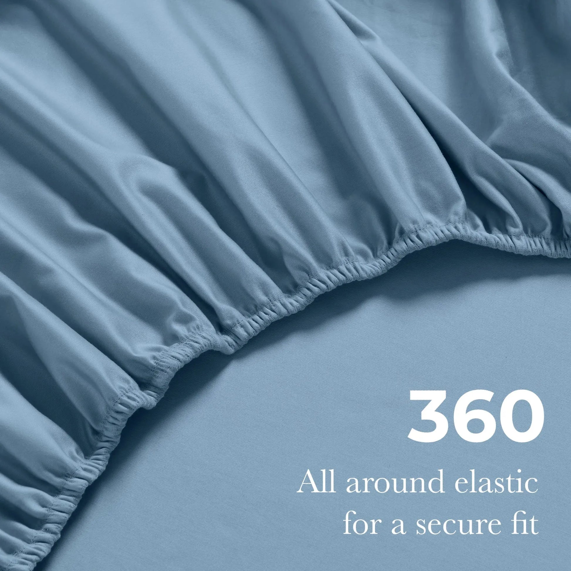Close-up of an Medium blue fitted sheet with 360-degree elastic for a secure fit around the mattress.