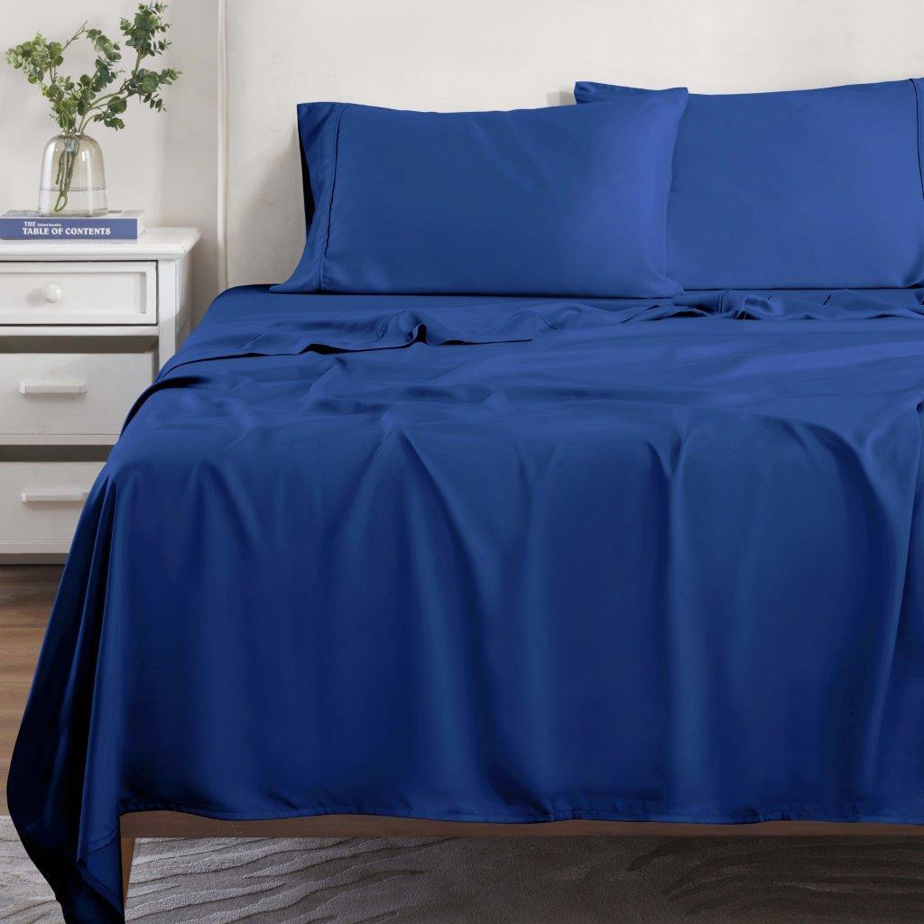 Navy blue 300 Thread Count Modal Sheets Set made from beechwood displayed on a staged bed