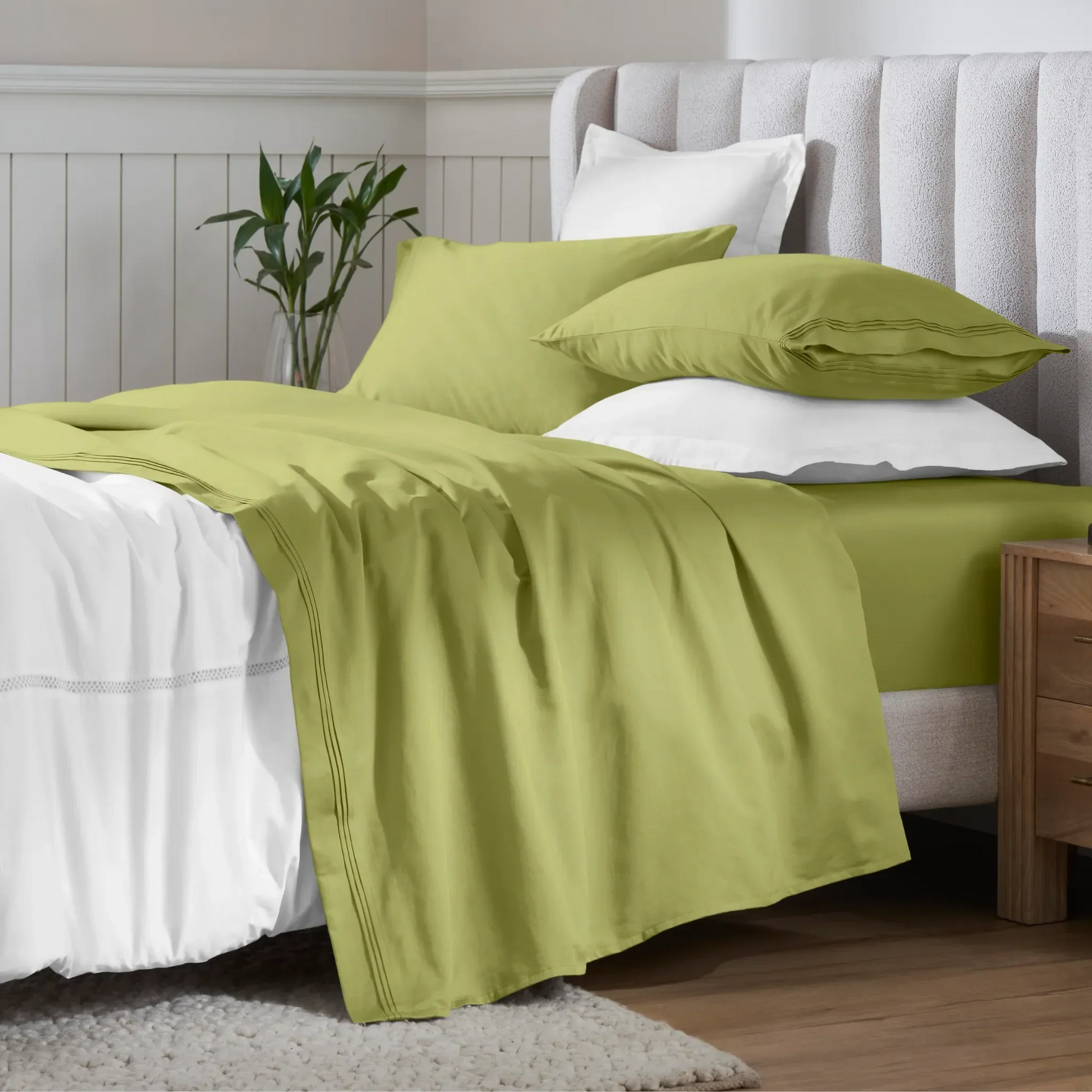 Olive green Egyptian Cotton Sateen Sheet Set styled on a modern bed with white accents