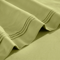Close-up of Olive green Egyptian cotton sateen sheet hems with decorative triple-row stitching.