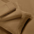 Overhead view of folded taupe brown cotton blend bed sheets and matching pillowcase layout