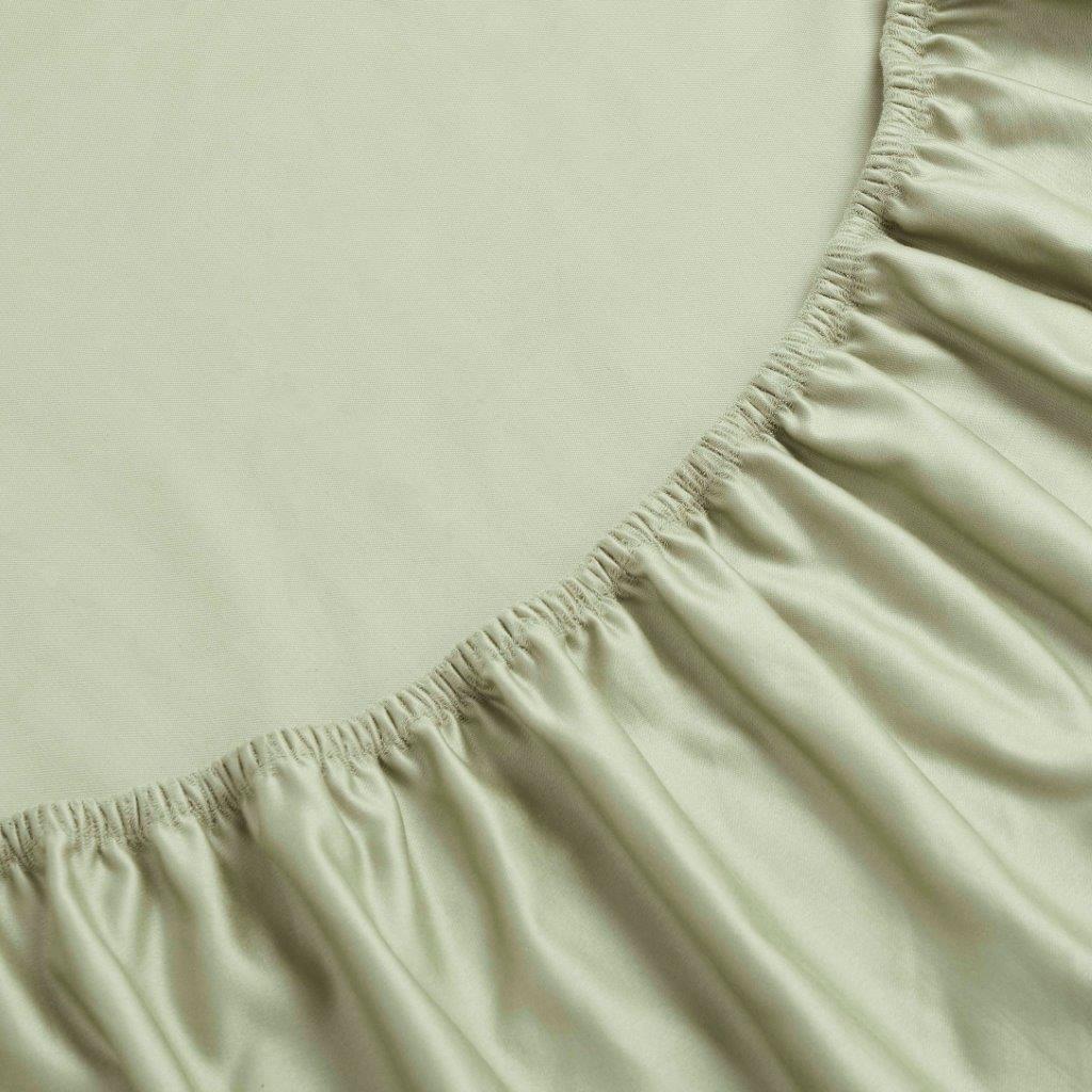 Sage Green 1500 Thread Count Egyptian Cotton Fitted Sheet corner elastic band close-up texture.