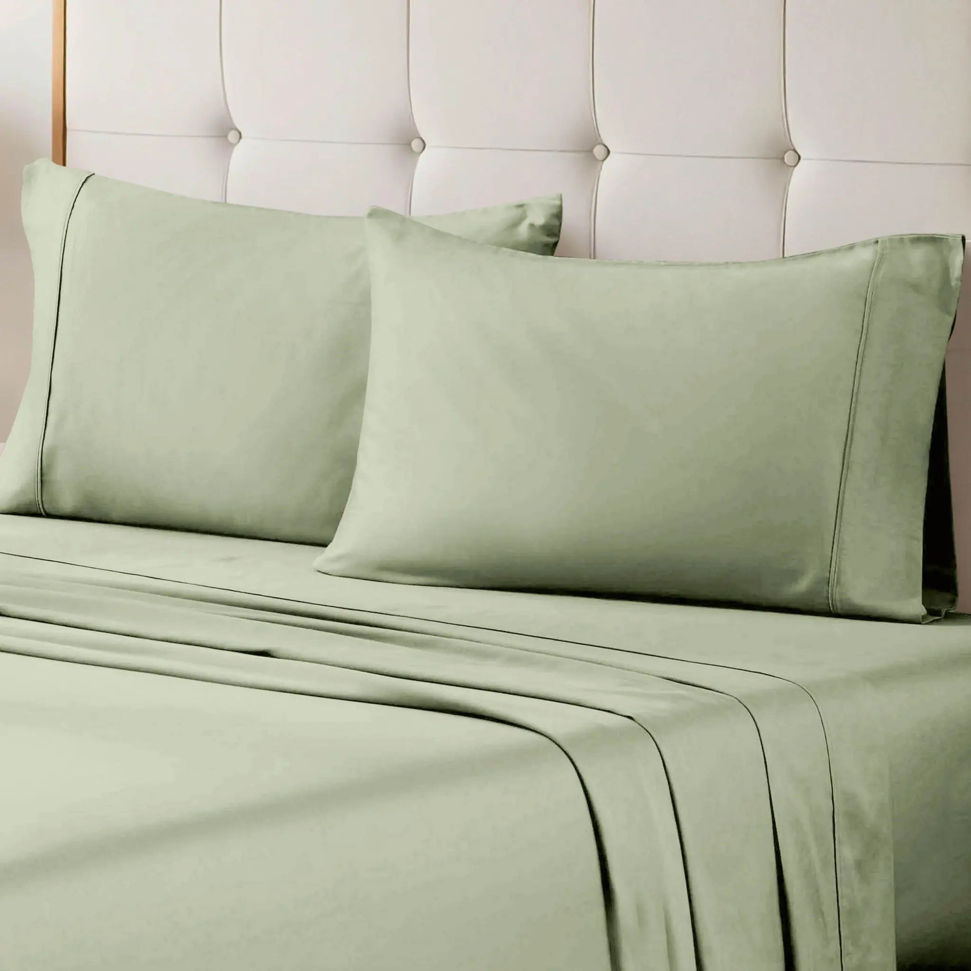 Sage green 700 Thread Count Egyptian Cotton Sateen Bed Sheet Set displayed on a modern bed