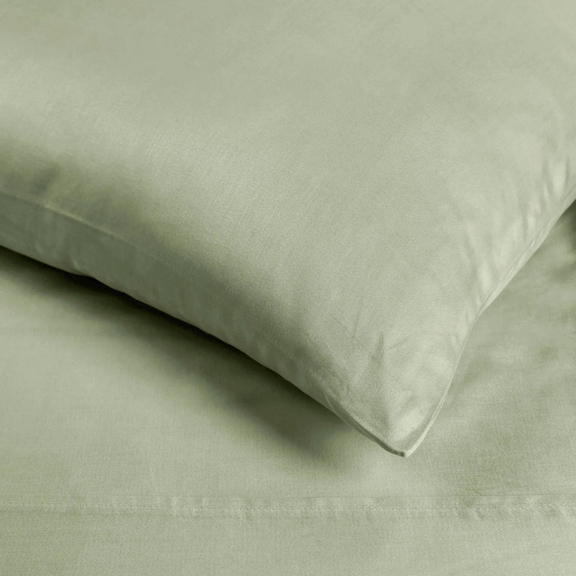 Sage green 700 Thread Count Egyptian Cotton Sateen sheet fabric texture close-up