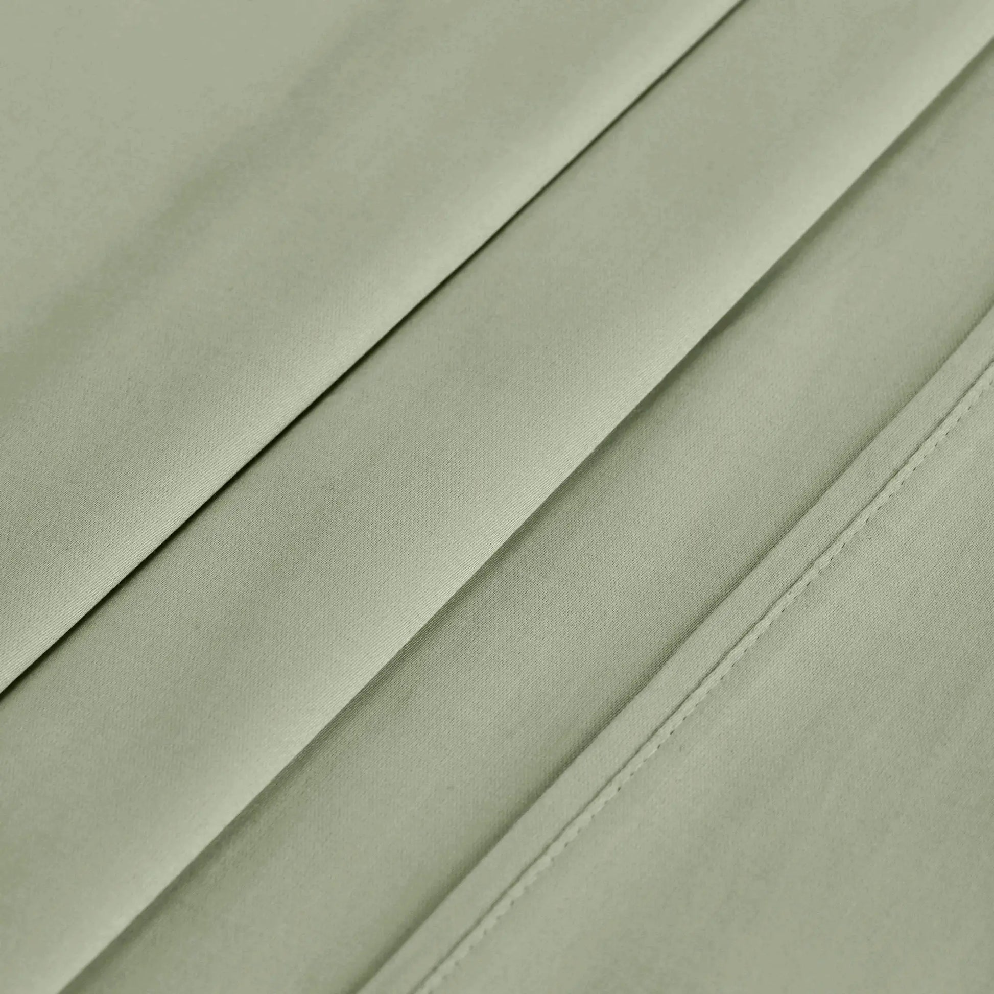 Sage green 700 Thread Count Egyptian Cotton Sateen sheet hem and stitching detail close-up