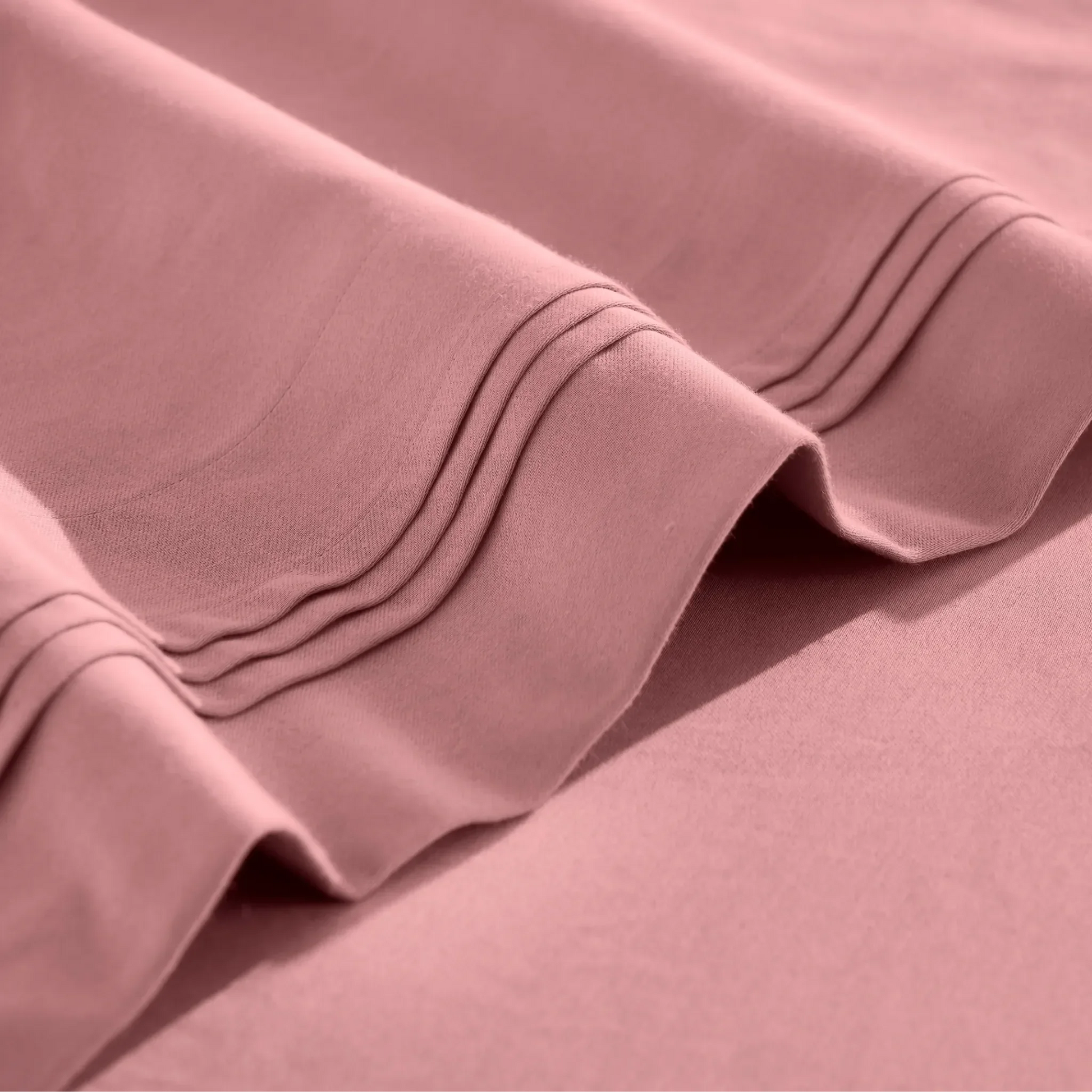 Stitched embroidery detail on blush pink Egyptian Cotton Sateen sheets