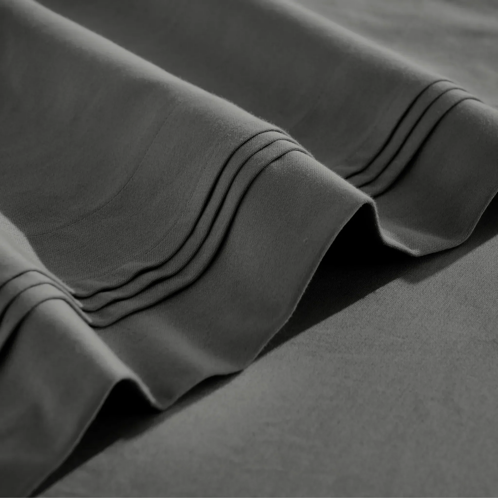 Stitched embroidery detail on grey Egyptian Cotton Sateen sheets