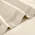 Stitched embroidery detail on ivory Egyptian Cotton Sateen sheets