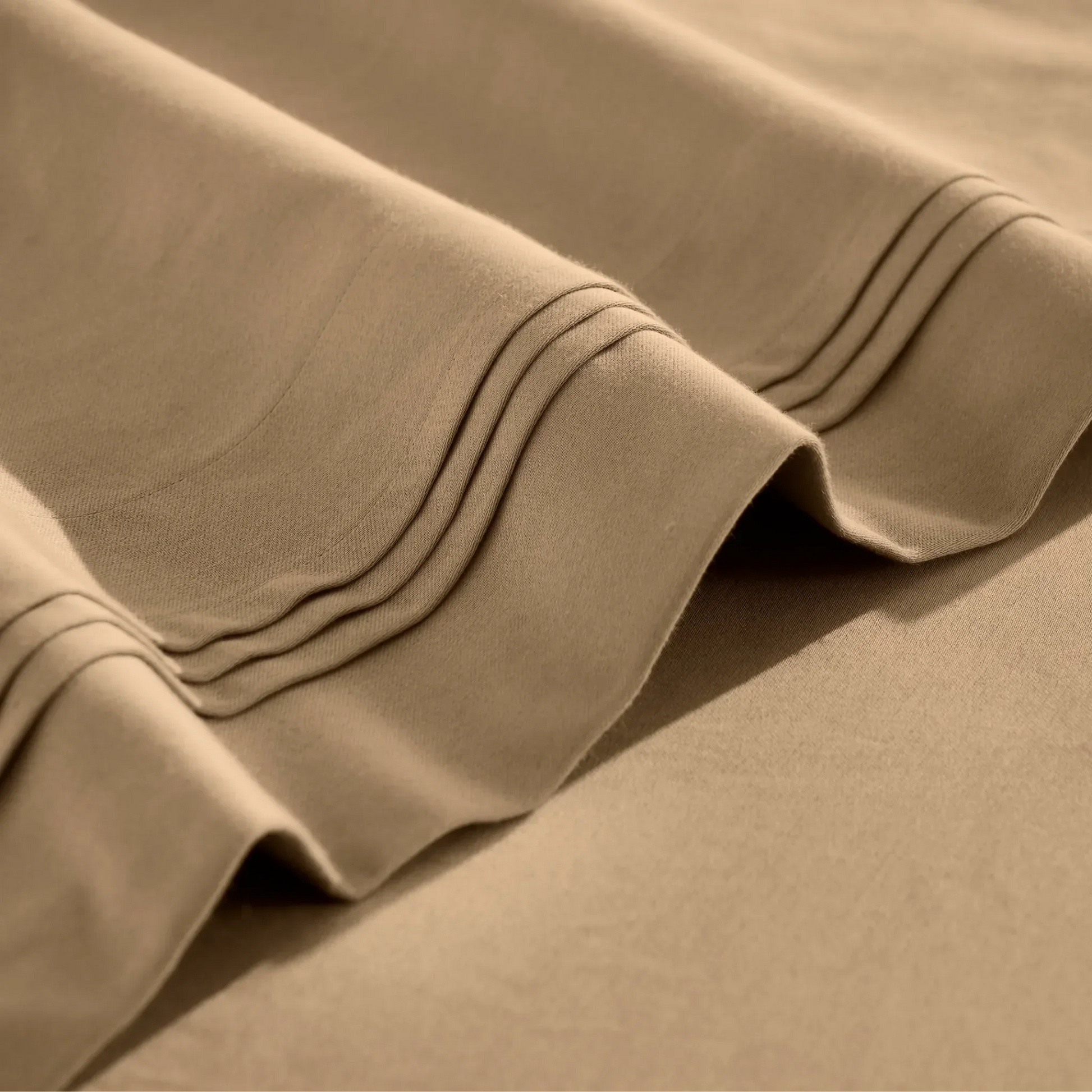 Stitched embroidery detail on taupe Egyptian Cotton Sateen sheets