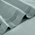 Stitched embroidery detail on teal blue Egyptian Cotton Sateen sheets