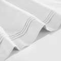 Stitched embroidery detail on white Egyptian Cotton Sateen sheets